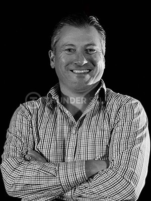 Rodric David, smiling with arms crossed, in official headshot as the Chairman and CEO of Thunder Studios
