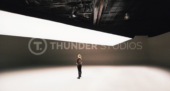 At-Rodric-Davids-Thunder-Studios-a-crew-member-stands-under-a-large-Fisher-light-for-Distribution-102-post