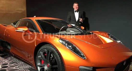 Rodric David stands with the James Bond Spectre Jaqguar X75 at the BAFTA awards dinner.